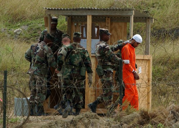 Marines transport an inmate at Guantanamo Bay (Stock image)