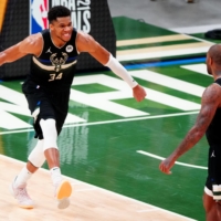 Milwaukee Bucks forward Giannis Antetokounmpo celebrates during Game 6 of the NBA Finals on Tuesday.  | USA TODAY / VIA REUTERS