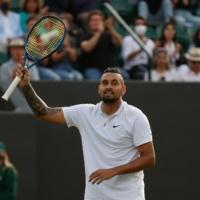 Nick Kyrgios celebrates after his second-round win over Gianluca Mager at Wimbledon in London on Thursday. | AFP-JIJI