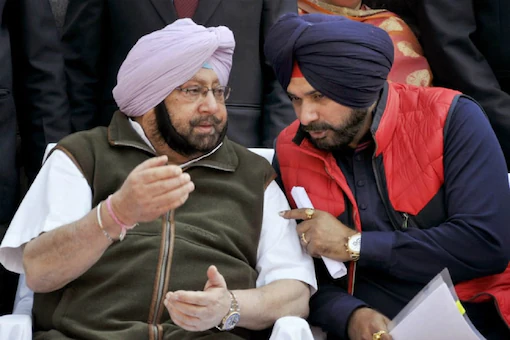 File photo of Congress leader Navjot Singh Sidhu (right) with Punjab CM Amarinder Singh.