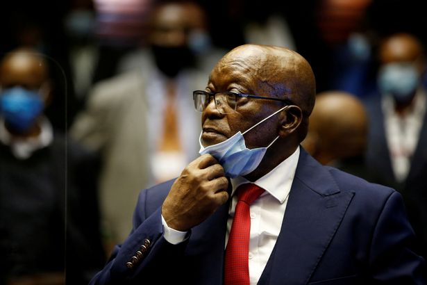 Former South African President Jacob Zuma stands in the dock