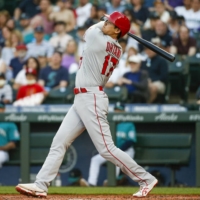 Los Angeles Angels designated hitter Shohei Ohtani hits a solo home run against the Seattle Mariners during the third inning at T-Mobile Park in Seattle on Friday.   | USA TODAY / VIA REUTERS