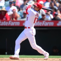 Los Angeles Angels designated hitter Shohei Ohtani hits a solo home run against the Boston Red Sox during the fifth inning at Angel Stadium on Wednesday.  | GARY A. VASQUEZ / USA TODAY / VIA REUTERS