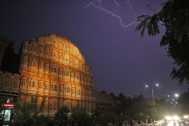 Lightning strike in the sky during the rain near Hawa Mahal in Jaipur, Rajasthan, India