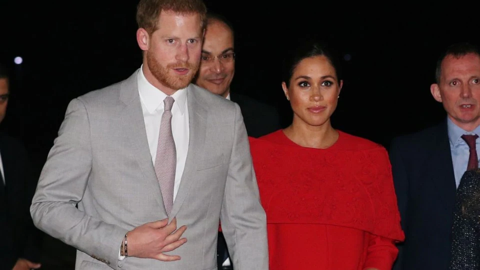 Meghan Markle in red Valentino cape dress.(Reuters)