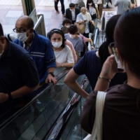 People in Tokyo's Shibuya district on Aug. 5 | AFP-JIJI