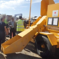 A supplied photo shows the interviewed Afghan man (second from right) working in Japan's development aid project in Afghanistan. Parts of the photo have been obscured for privacy reasons. | KYODO