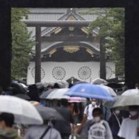 People visit Yasukuni Shrine in Tokyo on Sunday, the 76th anniversary of Japan's surrender in World War II.  | KYODO