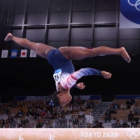 Simone Biles of the United States on the balance beam at the Tokyo Games on Tuesday  | MIKE BLAKE / REUTERS