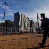 A police officer on patrol at the athletes village earlier on Monday.  | REUTERS