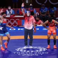 Cuba's Luis Alberto Orta Sanchez is declared the winner of his 61-kg Greco-Roman wresting final.  | REUTERS