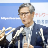 Shigeru Omi speaks during a news conference at the Cabinet Office on Aug. 12. | KYODO