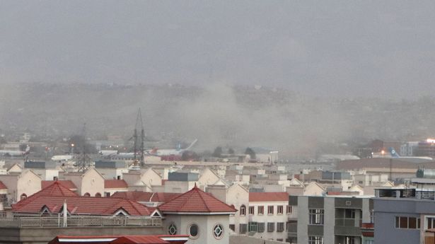 Smoke billows from the airport area after a blast outside the Hamid Karzai International Airport