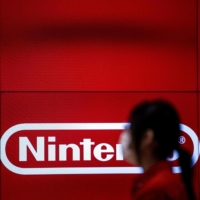 An employee in a Nintendo store in Tokyo.  | AFP