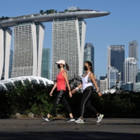 Rebounding from the carousel of COVID-19 closures and reopenings is going to be tough on Singapore. Even harder will be papering over the social and economic divisions that have deepened because of the disease. | AFP-JIJI