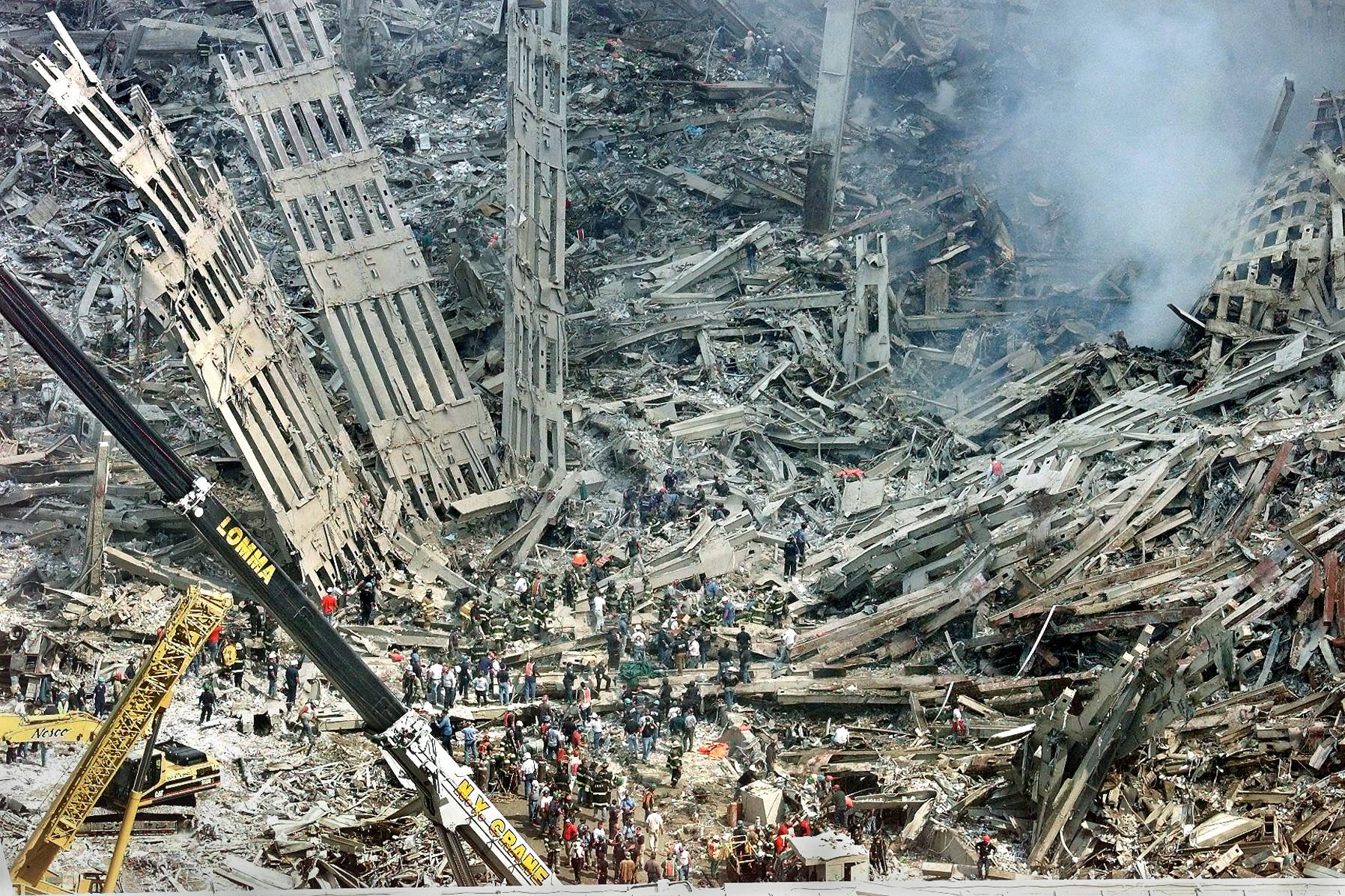 Emergency personnel comb through the wreckage of the World Trade Center in New York on Sept. 12, 2001. | RUTH FREMSON / THE NEW YORK TIMES