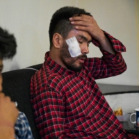 Afghan newspaper journalists Neamat Naqdi (right) and Taqi Daryabi sit in their office on Wednesday after being released from Taliban custody in Kabul. | AFP-JIJI