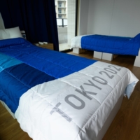 The recyclable beds from the athletes' village in Tokyo are likely to be used at a temporary medical facility in Osaka by the end of this month. | POOL / VIA REUTERS