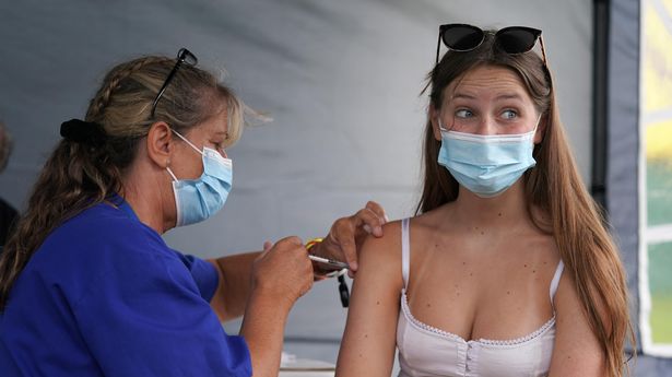 16-year-old festival goer Jam Budden receives a vaccine jab at a walk-in Covid-19 vaccination clinic at the Reading Festival