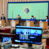 The four candidates running in the ruling Liberal Democratic Party's presidential election attend a debate sponsored by the Japan National Press Club in Tokyo on Saturday. The four — vaccination minister Taro Kono (left), former Foreign Minister Fumio Kishida (center left), former communications minister Sanae Takaichi (center right) and Seiko Noda, executive acting secretary-general of the LDP (right) — are vying for the post currently held by Prime Minister Yoshihide Suga. | POOL / VIA KYODO