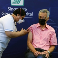 Singapore's Prime Minister Lee Hsien Loong receives a COVID-19 booster shot at the Singapore General Hospital on September 17, 2021.  | REUTERS