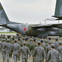 A Self-Defense Force C-130 transport plane prepares to depart for an operation to rescue Japanese nationals in Afghanistan from the Iruma Air Base in Sayama, Saitama Prefecture, on Aug. 24. | KYODO
