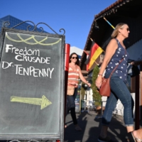 People arrive for an event in Huntington Beach, California, on Aug. 5, where Sherri Tenpenny was scheduled to speak.  | AFP-JIJI