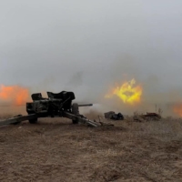 Service members of the Ukrainian Armed Forces hold artillery drills at a shooting range in an unidentified location in eastern Ukraine. | PRESS SERVICE OF THE 92ND SEPARATE MECHANIZED BRIGADE / VIA REUTERS