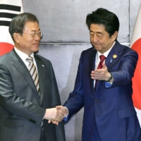 Prime Minister Shinzo Abe and South Korean President Moon Jae-in during a meeting in Chengdu, China, in December 2019.  | KYODO