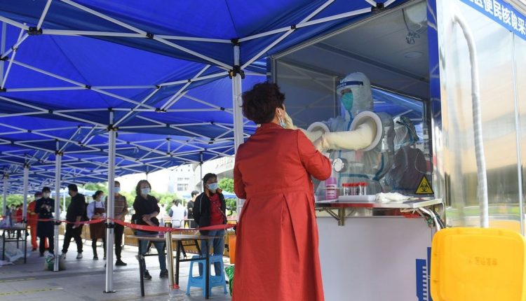 Across China, cities crack down to avoid virus surge, upending business