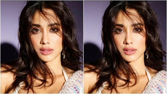 Janhvi added more oomph to her look with a white halterneck bralette with sequins and a knotted detail at the back.(Instagram/@janhvikapoor)
