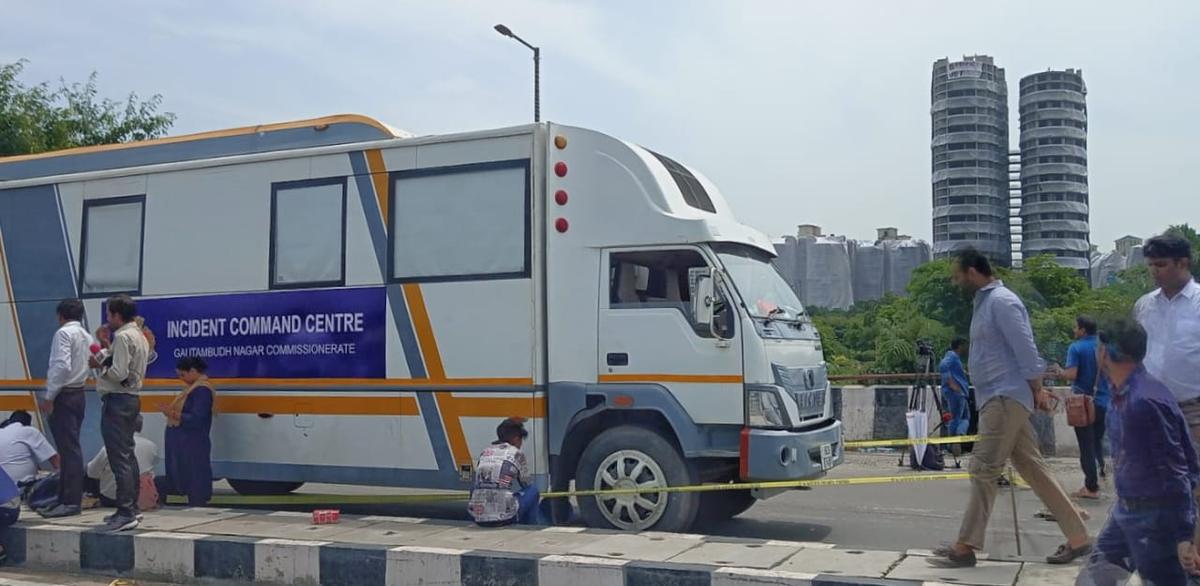 Incident Command Centre van to monitor the demolition of the Twin Towers, seen in the background at Noida.