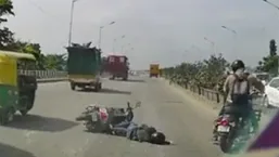 The horrific clip - that was apparently recorded in a dash camera of a car behind the bike - showed a woman hitting the ground. The horrific clip - that was apparently recorded in a dash camera of a car behind the bike - showed a woman hitting the ground.