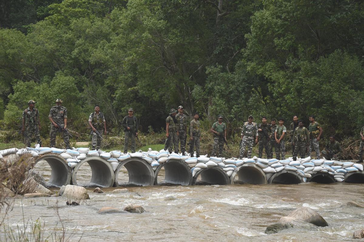 A bridge built by placing sandbags on Hume pipes (concrete tubes). 