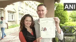 The newly married couple with their marriage certificate in Dharamshala, Himachal Pradesh. 