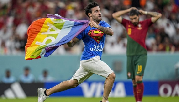 Spectator with rainbow flag runs onto field at World Cup | Football News