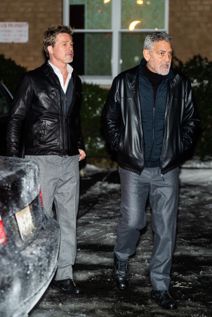 Brad Pitt (L) and George Clooney are seen filming on location for “Wolves” in Sugar Hill on January 24, 2023 in New York City.