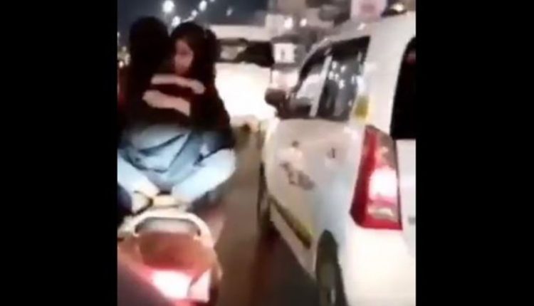 PDA on Two-Wheeler: Youth Arrested for Romancing on Running Scooty in Lucknow, Watch Viral Video