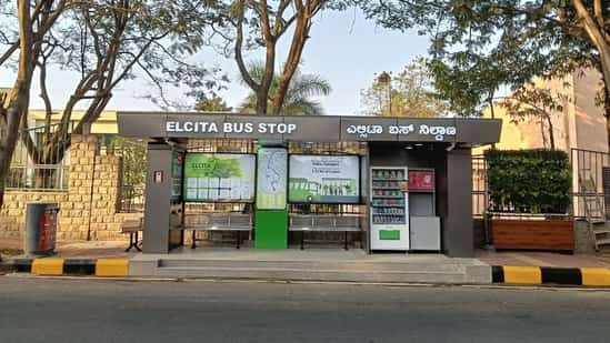 The bus stop is equipped with vending machines for snacks and sanitary napkins, charging points for phones and laptops, and smart dustbins.