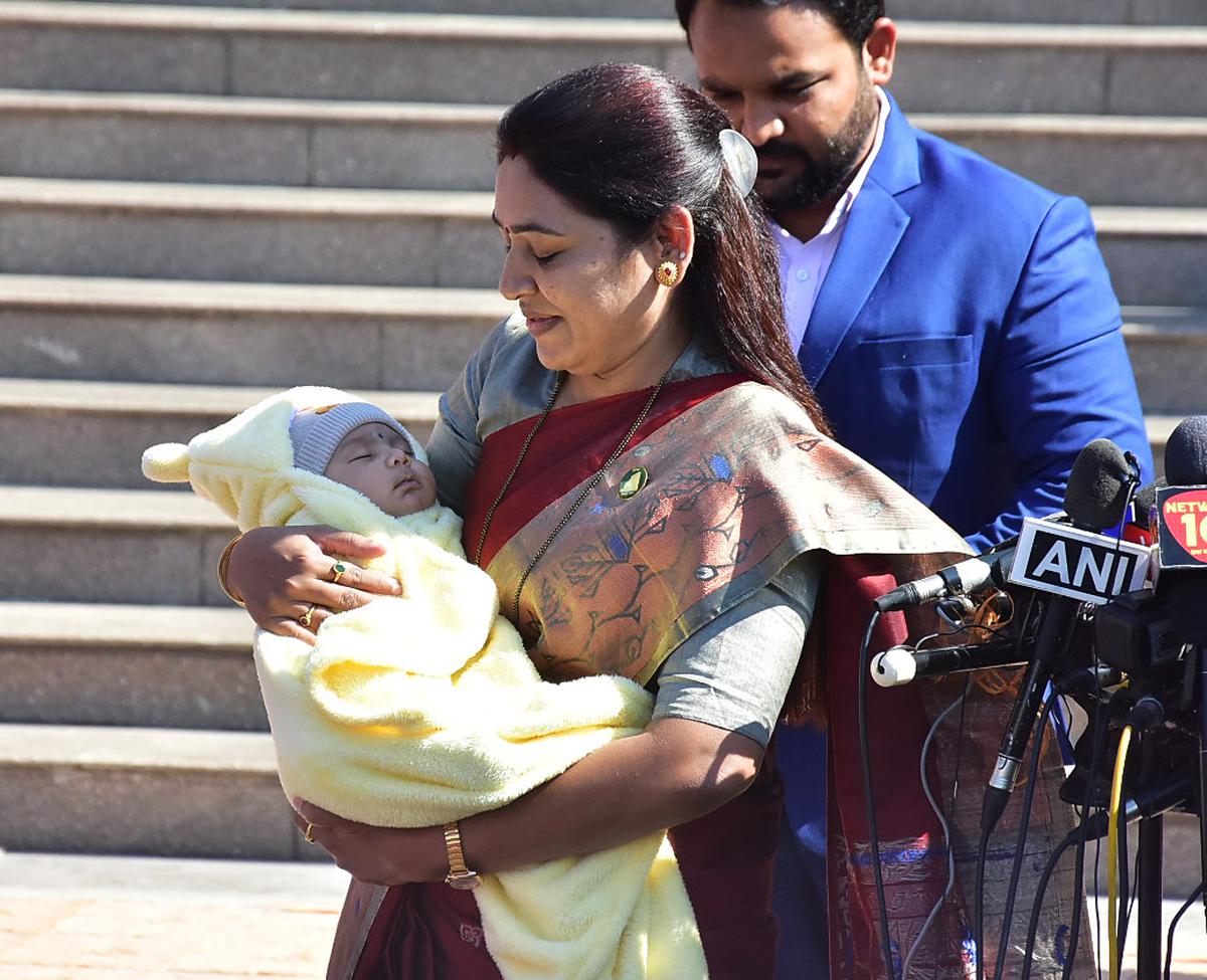 Nationalist Congress Party MLA Saroj Babulal Ahire arrives with her newborn baby to attend the first day of the Winter Session of the Maharashtra Assembly, at the State Assembly, in Nagpur. File