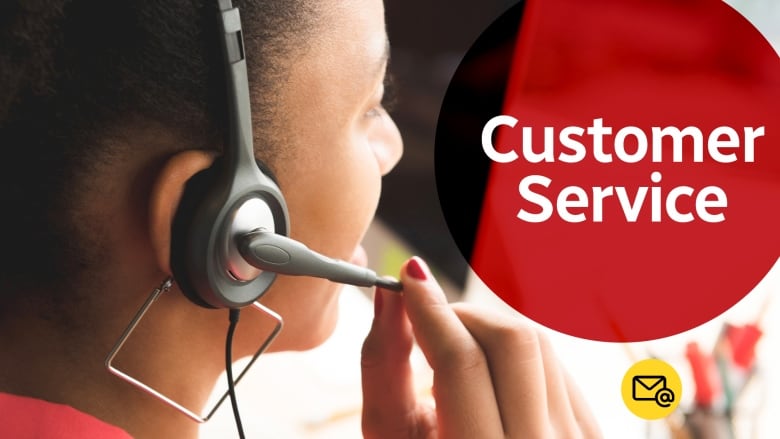 A customer service rep holding her headset.