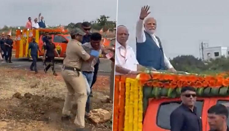 Security Breach at PM Narendra Modi’s Roadshow in Karnataka as Man Tries To Run Towards Convoy, Detained (Watch Video)