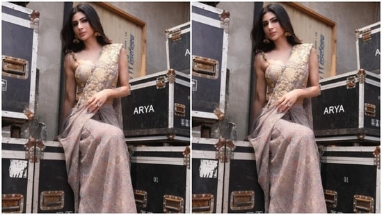 Mouni played muse to fashion designer duo Nikita Vishakha and picked a stunning grey georgette pre-draped saree from the shelves of their designer house. (Instagram/@imouniroy)