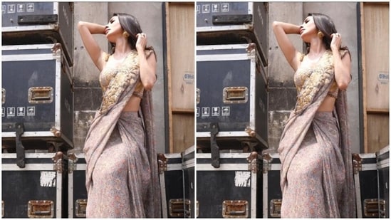 Styled by fashion stylist Rishika Devnani, Mouni wore her tresses open in wavy curls with a middle part as she posed for the sun kissed pictures. (Instagram/@imouniroy)