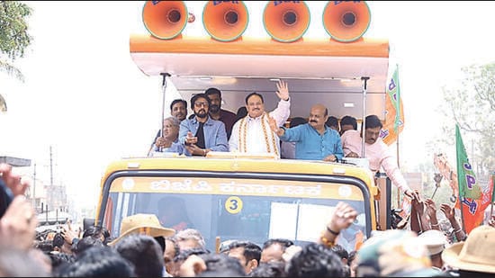 Chief minister Basavaraj Bommai, along with the BJP chief JP Nadda and Kannada film star Kichcha Sudeep, held a massive roadshow while he was on his way to file his nomination papers in Shiggaon. (HT Photo)