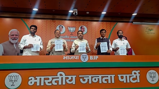 BJP leaders Dharmendra Pradhan and Mansukh Mandaviya release the party's first list of 189 candidates for the Karnataka assembly polls on Tuesday. (PTI)(HT_PRINT)