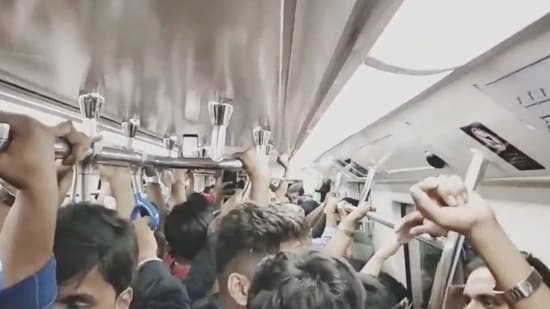 RCB fans cheer inside Bengaluru metro while returning from stadium. Watch