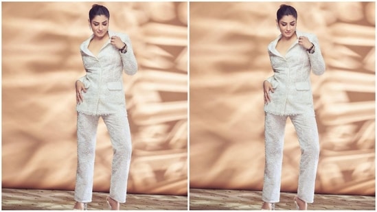 In her post, the actress can be seen posing gracefully in a stunning white-colored pantsuit. (Instagram/@officialraveenatandon)