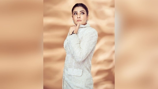 Raveena styled her hair into a sleek low bun to complete her sophisticated look.(Instagram/@officialraveenatandon)