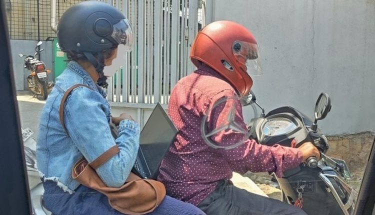 Twitter debate ensues after post on woman working on a laptop while on bike | Bengaluru